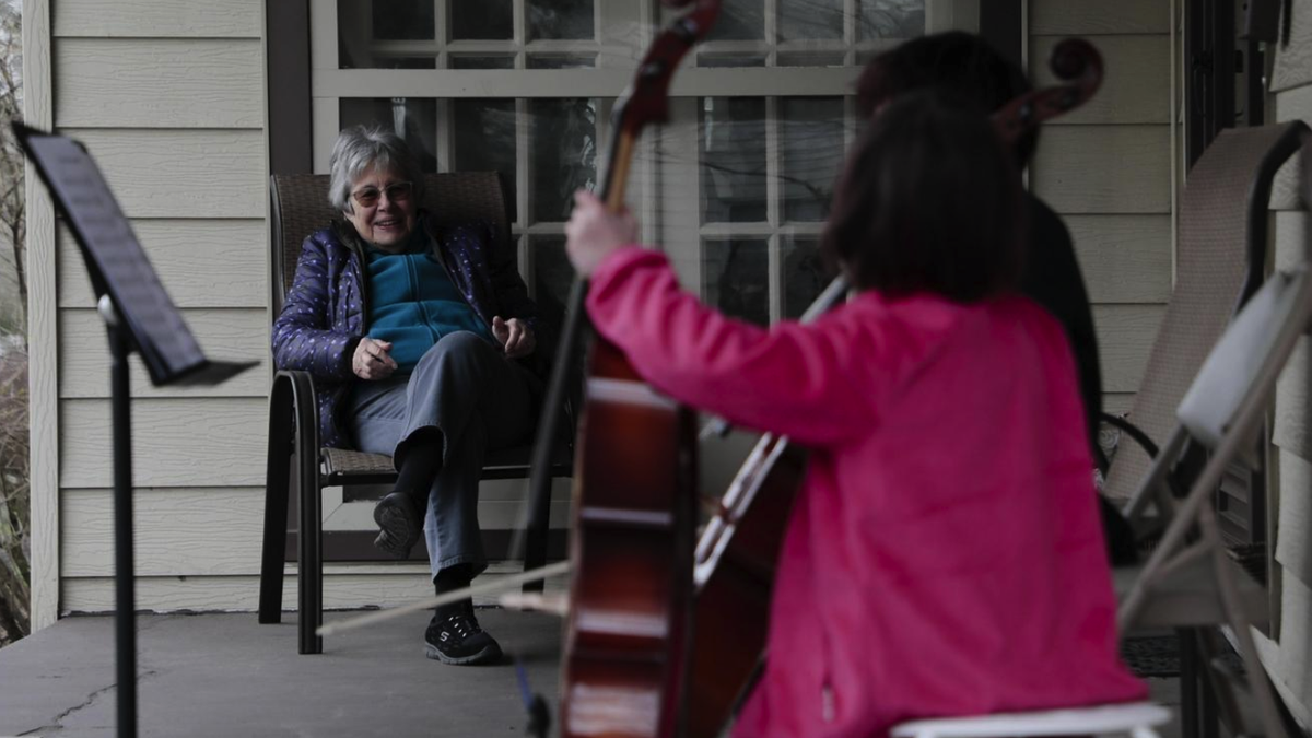 Kids put on porch concert for neighbor self-quarantining during coronavirus pandemic 1