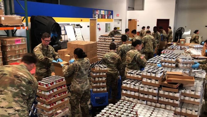 'I can't pay it back. So I pay it forward': Volunteers deliver food to quarantined coronavirus families 1