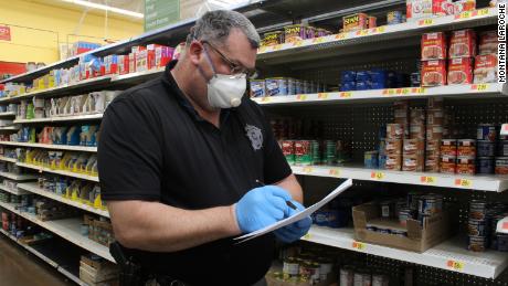 Coronavirus is placing these officers in a new role -- grocery deliverers 1