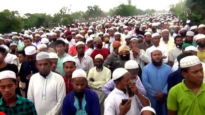 100,000 mourners defy coronavirus lockdown to attend funeral
in Bangladesh 1