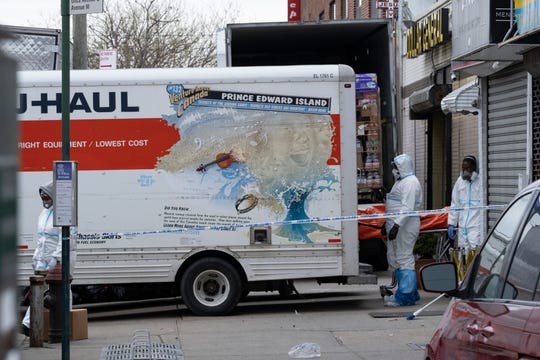 NYC funeral home overwhelmed by coronavirus deaths stores
bodies in moving trucks 1