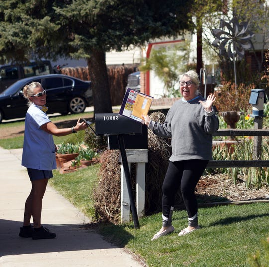 Postal carriers, delivery workers keep Americans safe at
home during coronavirus 1