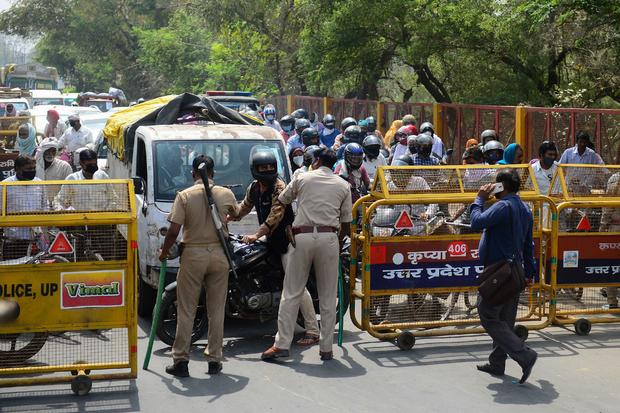 India eases coronavirus restrictions even as cases
surge 1