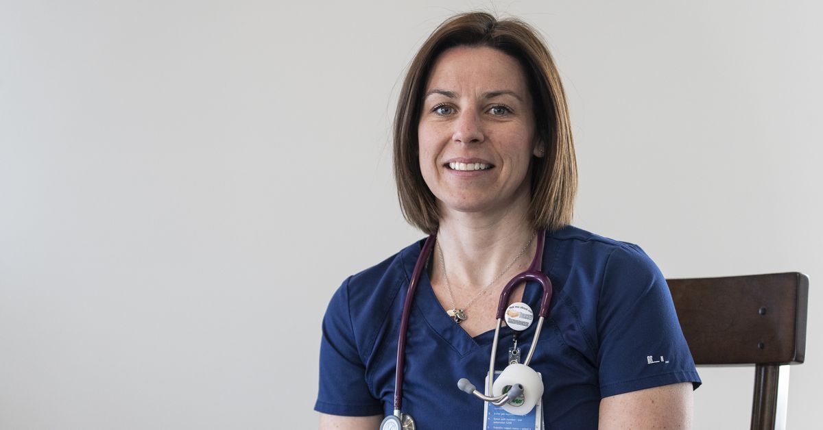When a coronavirus patient has no one else, a suburban Chicago nurse holds her hand and prays with her 1