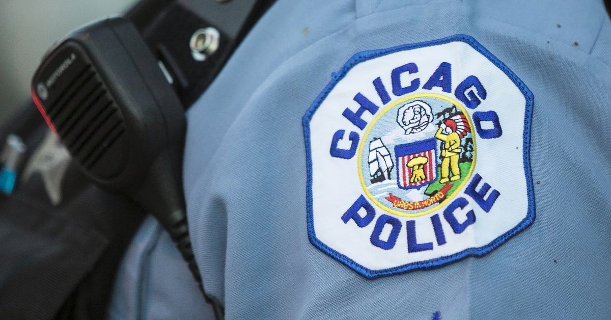 Two Chicago police officers charged with beating teen during
January arrest in Woodlawn 1