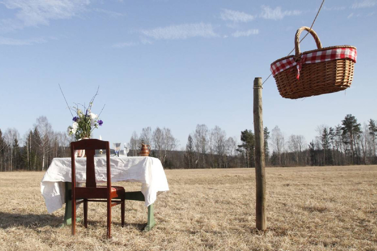 Couple opening ‘COVID-19-safe restaurant’ in a meadow with 1
chair, 1 table 1