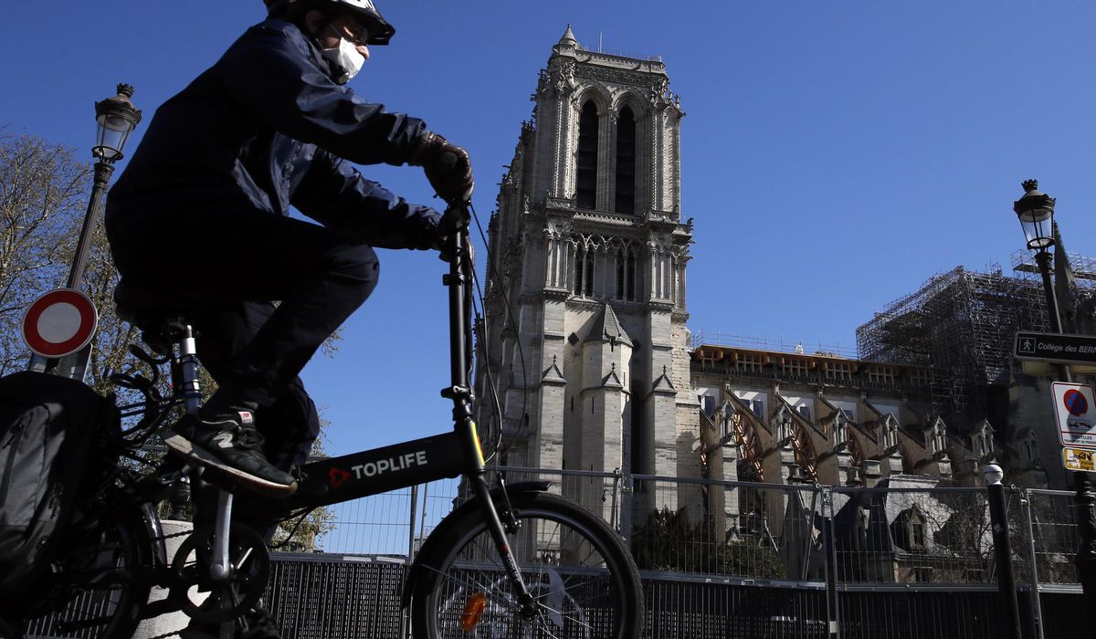 Still scarred, Notre Dame lives anew in coronavirus crisis 1