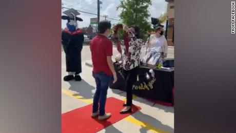 Several grads test positive for coronavirus after prep
school's drive-thru ceremony 1