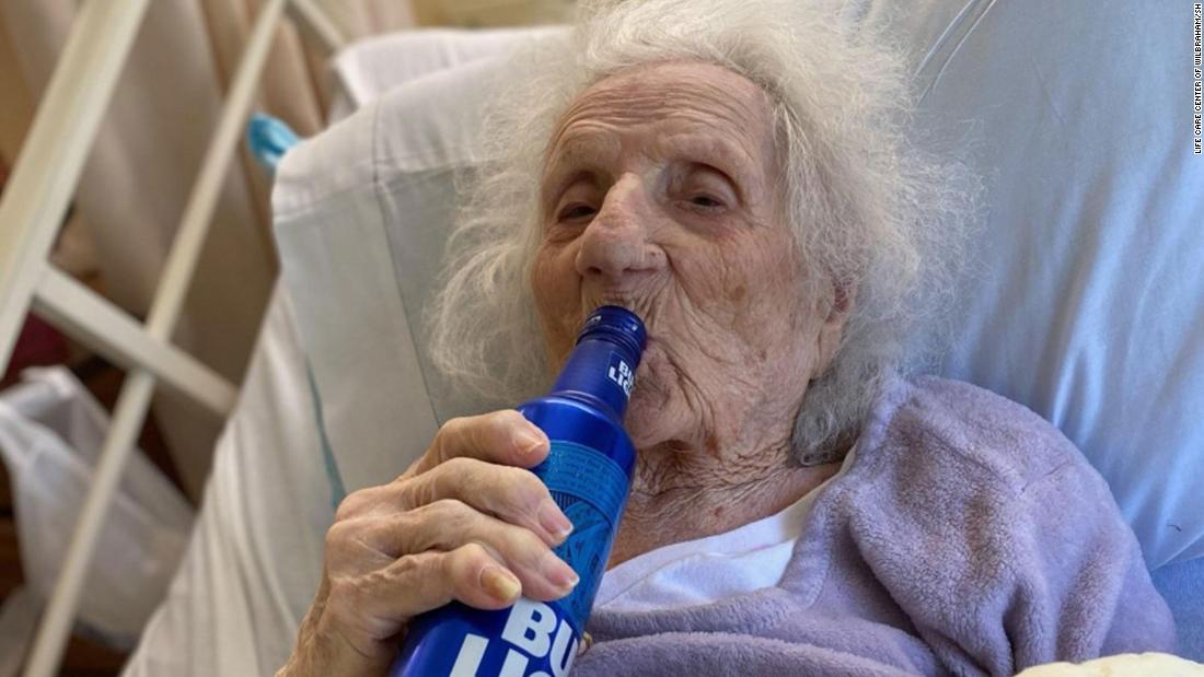 103-year-old woman celebrates beating Covid-19 with a cold
beer 1