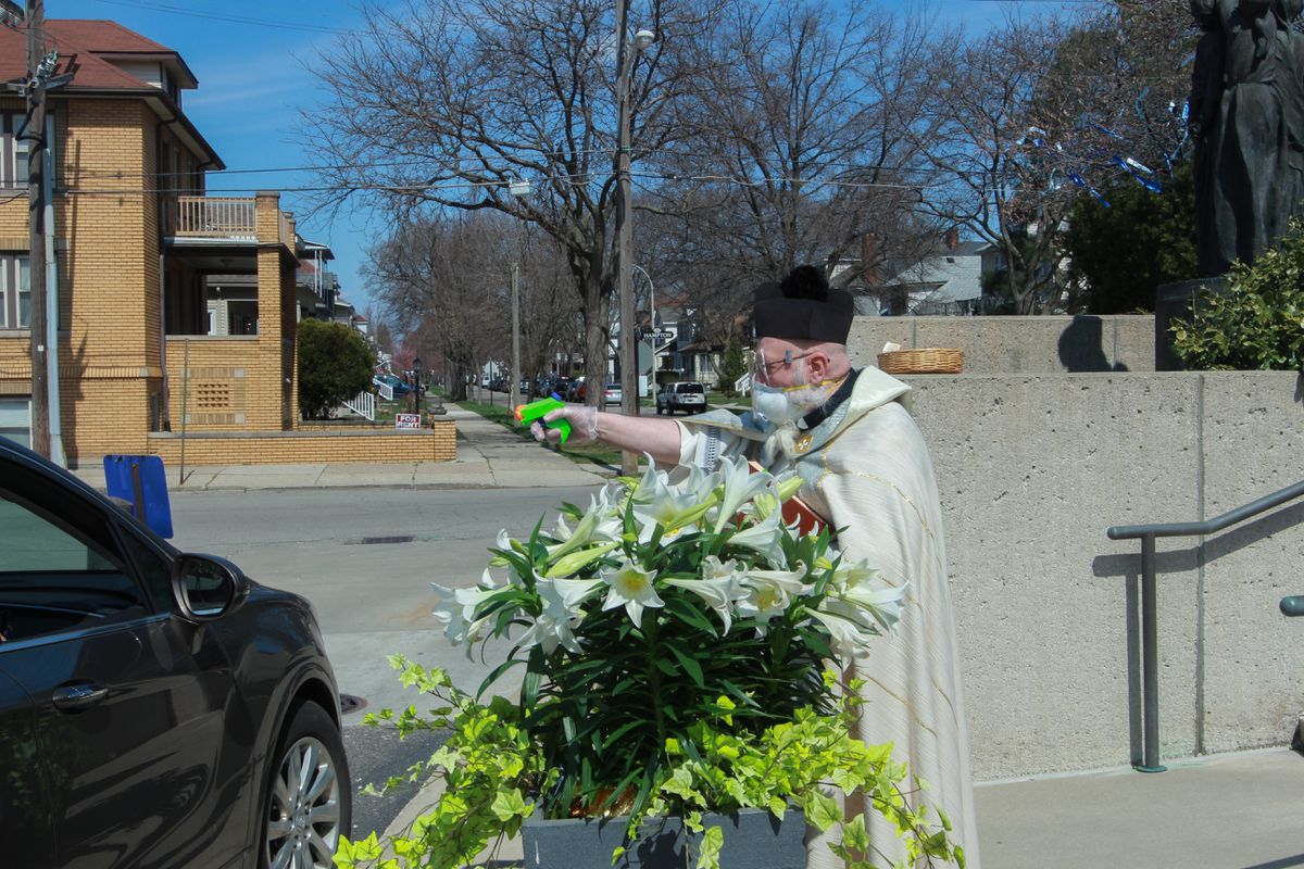 Michigan priest uses water gun to spread holy water due to
coronavirus 1 Michigan priest uses water gun to spread holy water due to
coronavirus 1