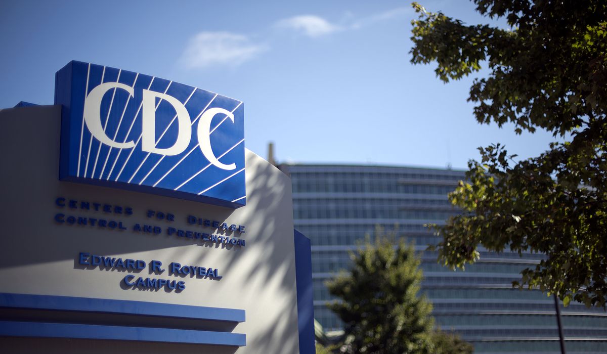 CDC now says COVID-19 'does not spread easily' on surfaces,
objects 1