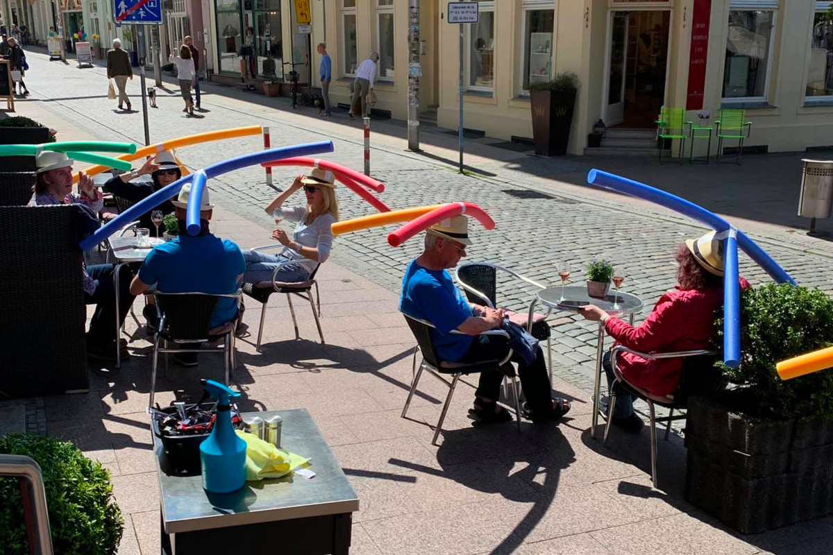 German cafe celebrates coronavirus reopening with pool
noodle hats 1