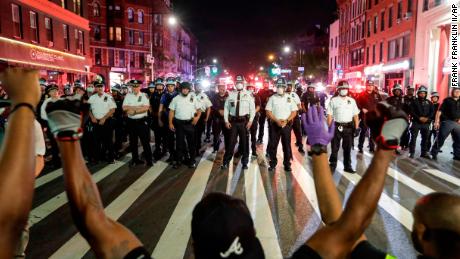A New York City police officer who shoved a protester to the
pavement is arrested 1