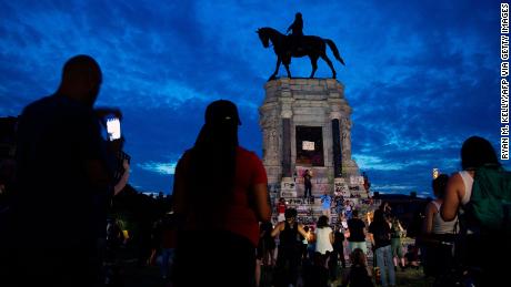 Protesters tore down a George Washington statue and set a
fire on its head 1
