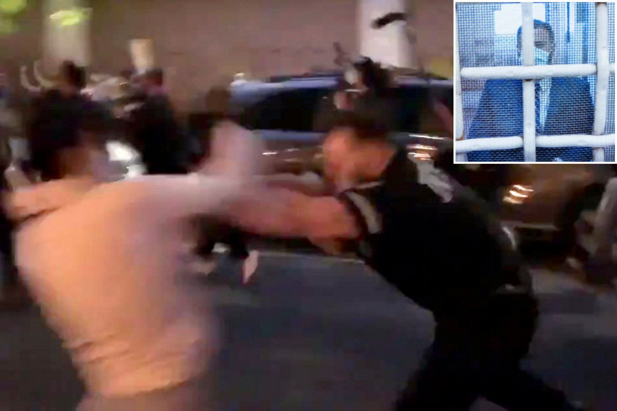 NYPD cop charged with shoving female protester freed without
bail 1