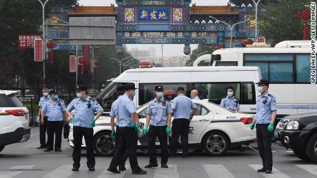 China's new coronavirus outbreak sees Beijing adopt
'wartime' measures 1