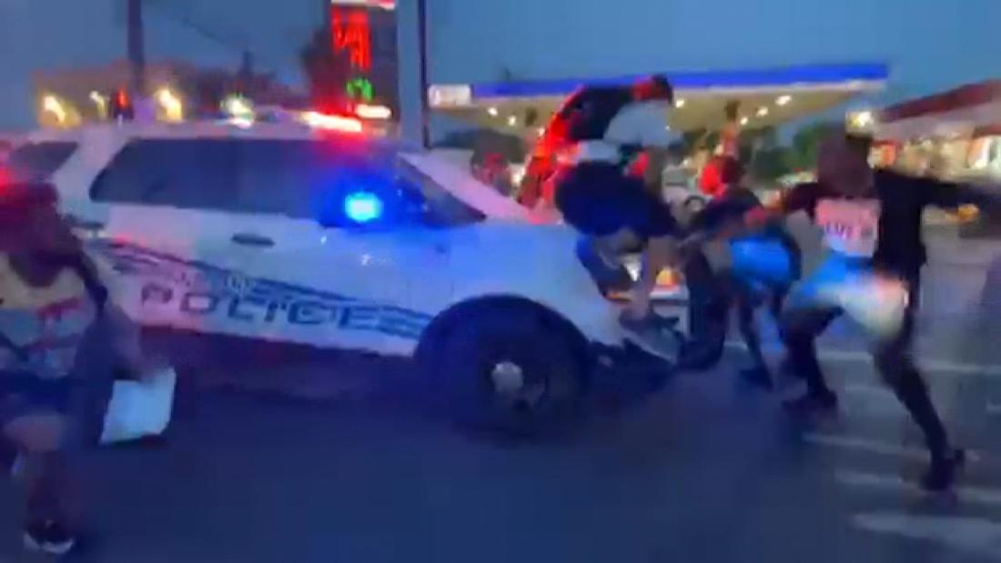 Video appears to show Detroit police car driving into
protesters 1