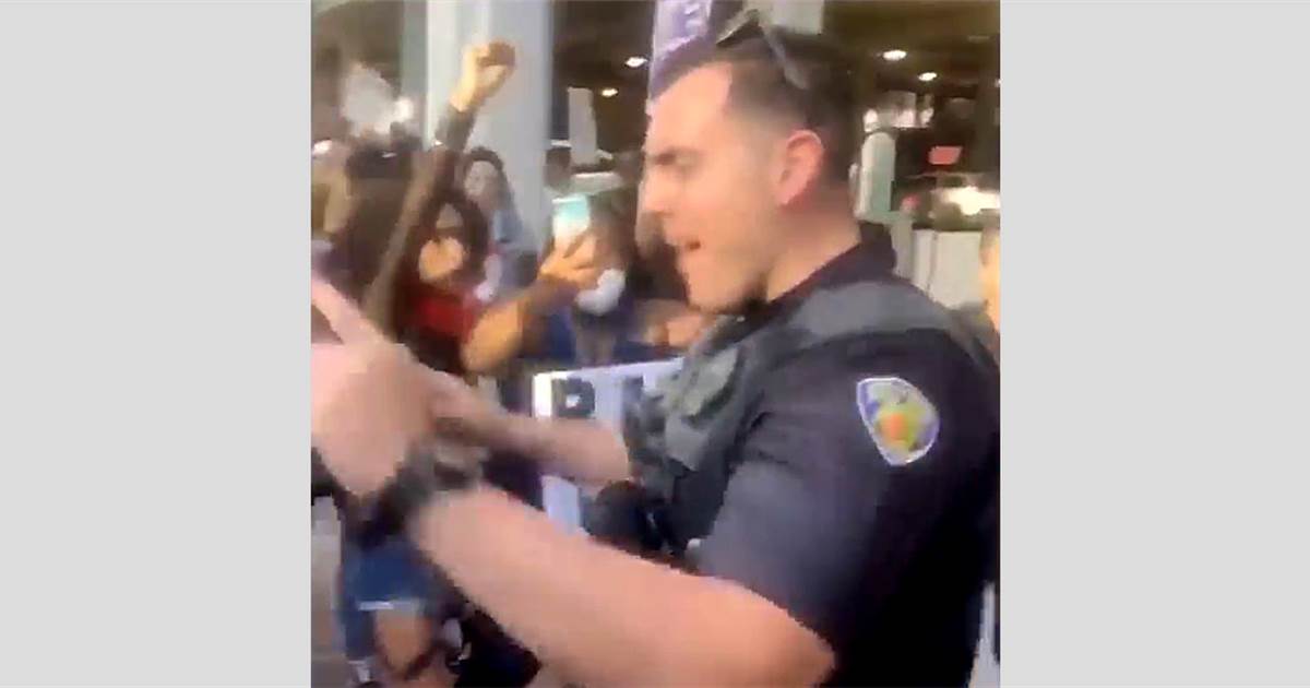 Florida officer caught on video pushing over kneeling
protester charged with battery 1