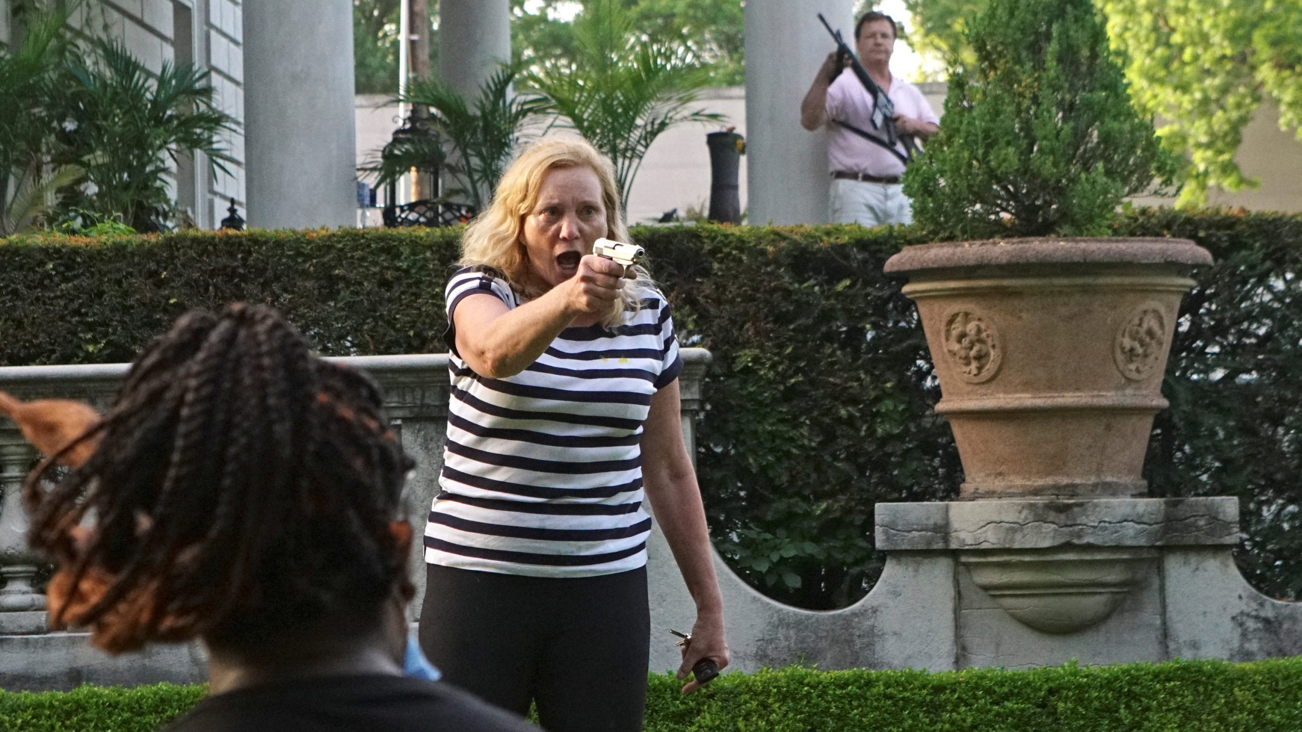 Trump Shares Video of Armed White Couple Confronting
Protesters 1
