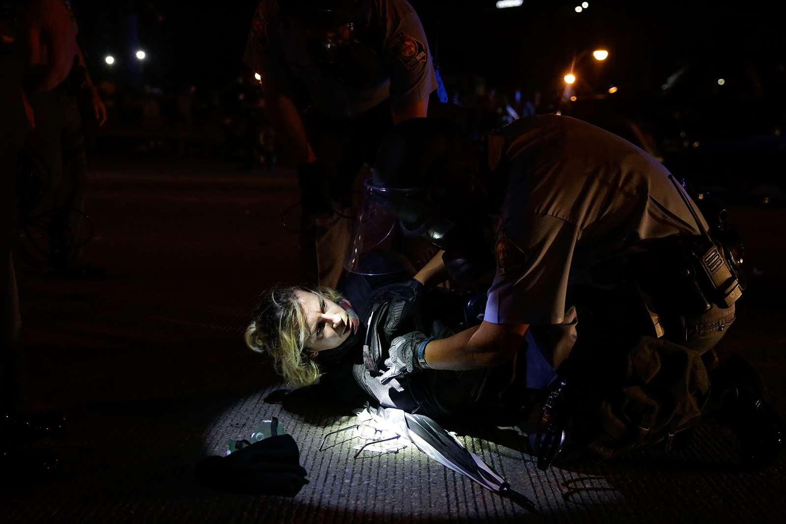 At least 36 people were arrested, police say, in protests
that were sparked by the killing of a black man 1