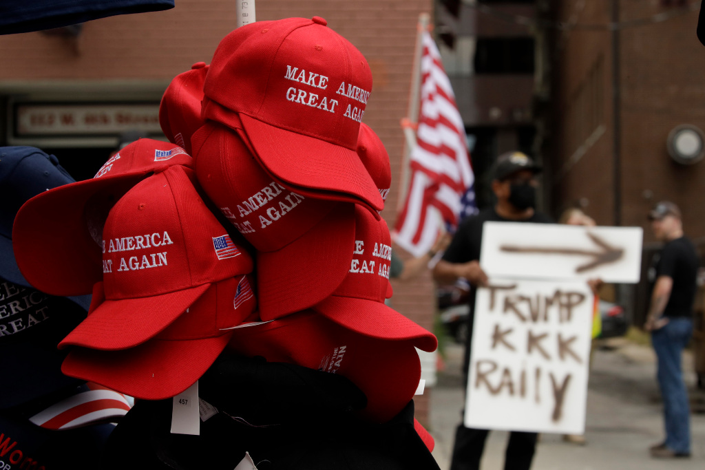 Metal barriers, Trump gear: Crowd readies for Tulsa campaign
stop as protesters rally outside 1