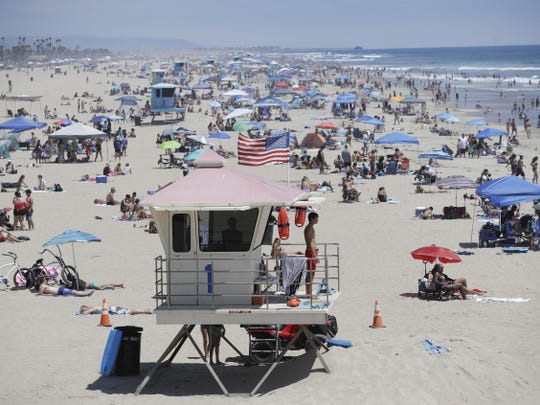 17 states are pausing reopening plans as COVID-19 cases,
hospitalizations surge. See the list. 1