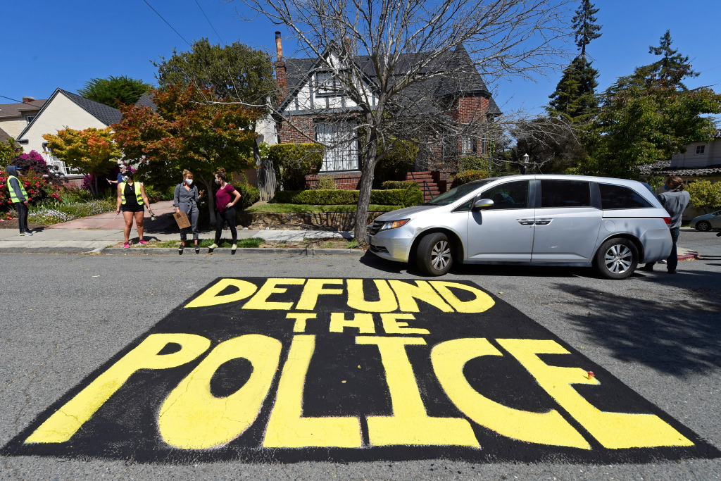 Photos: Protesters participate in Drive 4 Justice caravan in
Oakland to defund police 1