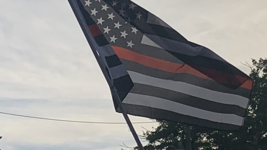 Newton residents protest mayor's decision to remove
firefighters remembrance flag 1