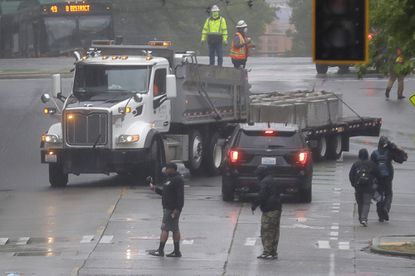City removes barricades at Seattle protest zone, protesters
promptly replace them 1