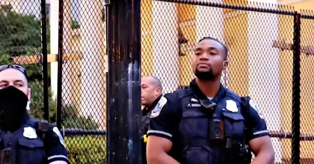 Watch -- D.C. Protesters Taunt Black Police Officer:
'F*ggot,' 'B*tch Ass' 1