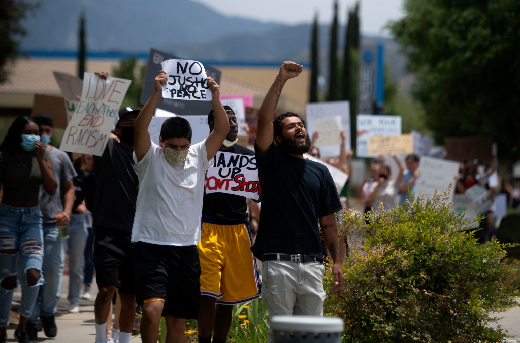 Speakers, upset over armed men at protest, call for
California councilman to resign for joining them 1
