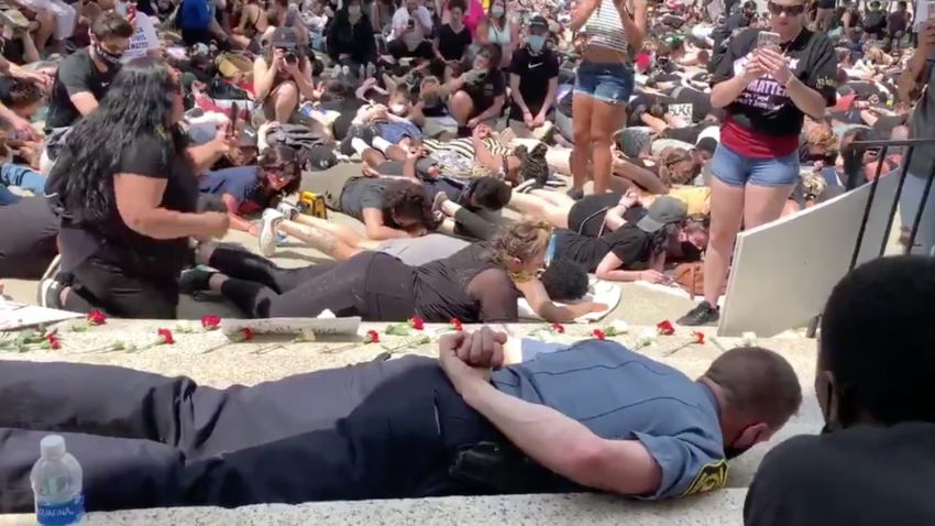 Webster police chief responds to backlash for lying down in
solidarity with protesters 1