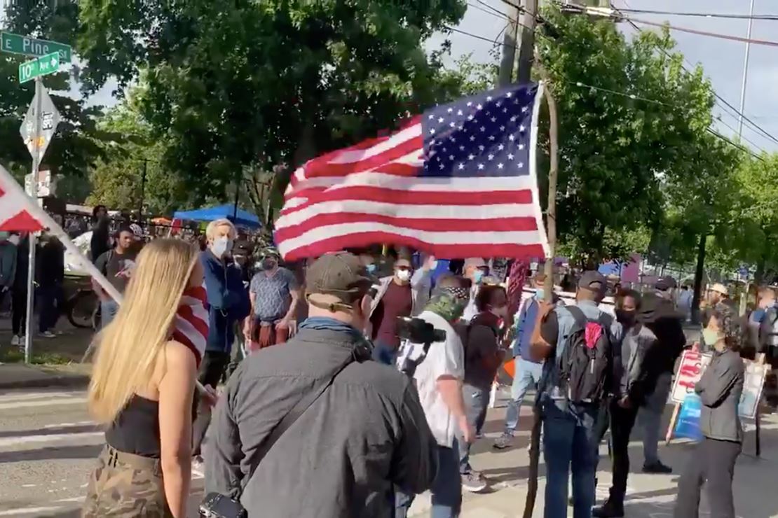 Protesters Branded 'White Supremacists' for Bringing
American Flags Into CHAZ 1