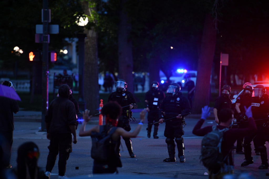 Denver to drop all curfew violation charges against
protesters 1