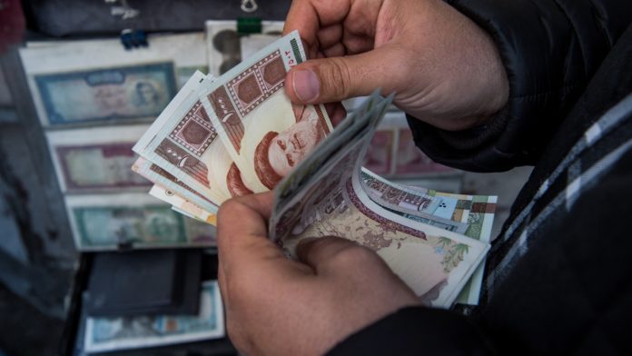 The Iranian Rial Falls to Lowest Value Ever, Largely Due to
US Sanctions and COVID-19 1