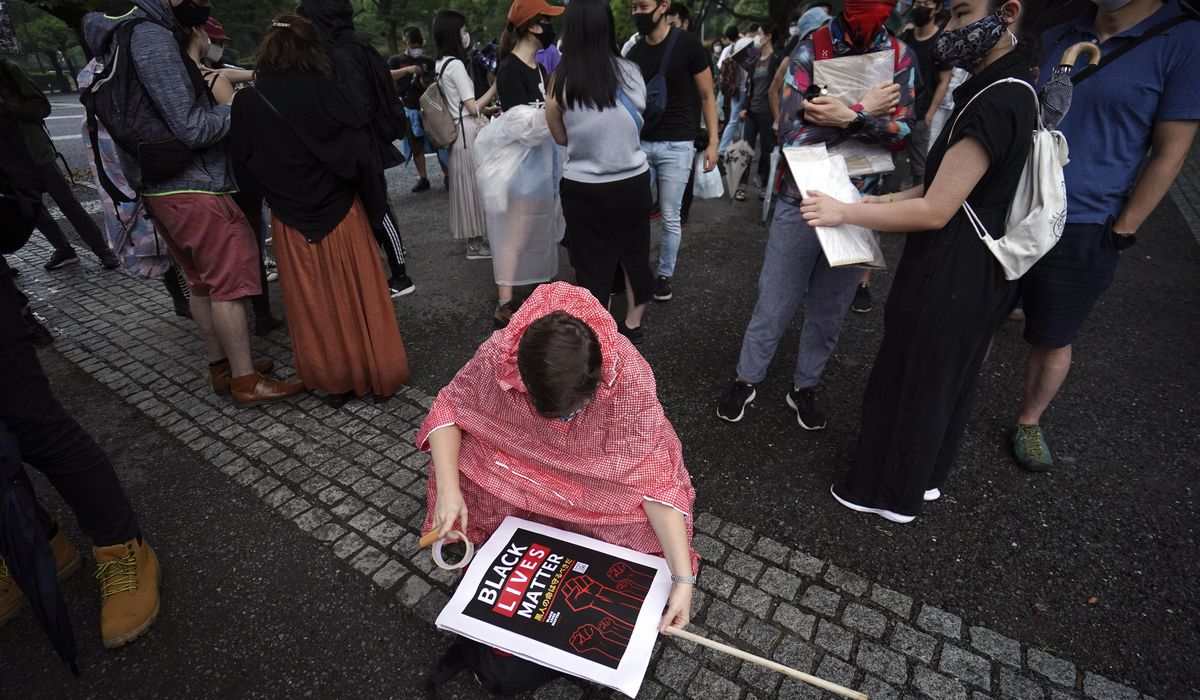 Japan, New Zealand march to mourn George Floyd, seek
change 1