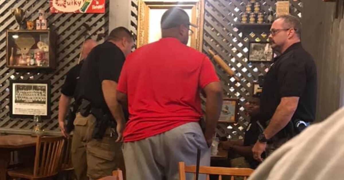 Moment of hope: Black man pays for table of police officers'
meals as nationwide protests continue 1