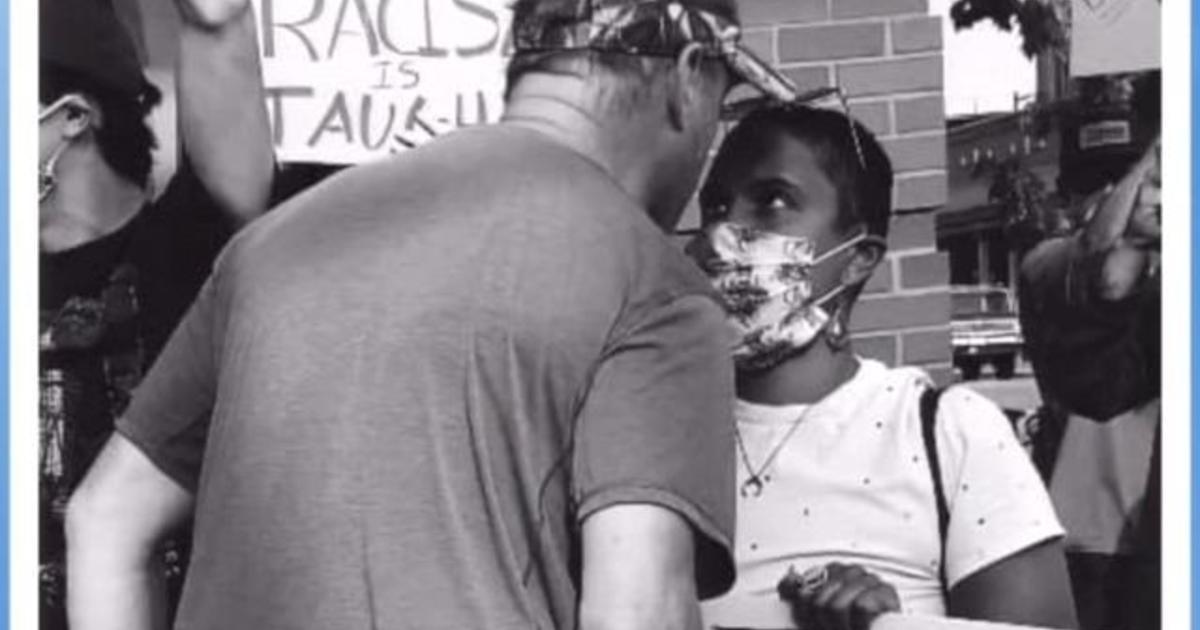 Protester stares down angry white man in powerful
image 1