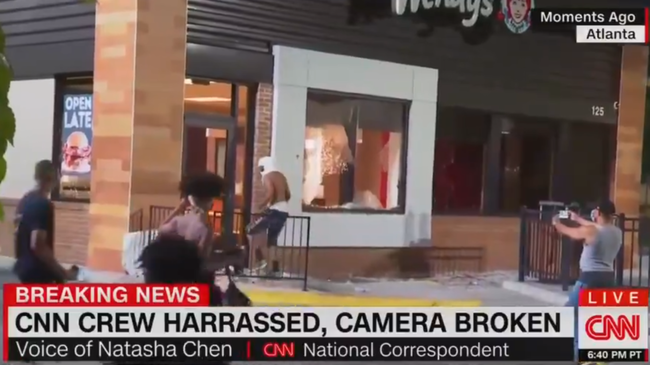 Watch: CNN Decries "Aggressive" Protesters After Camera Crew
Attacked 1