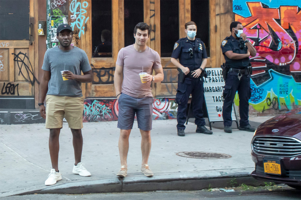 East Village partiers boo cops trying to break up sidewalk
drinking amid coronavirus 1
