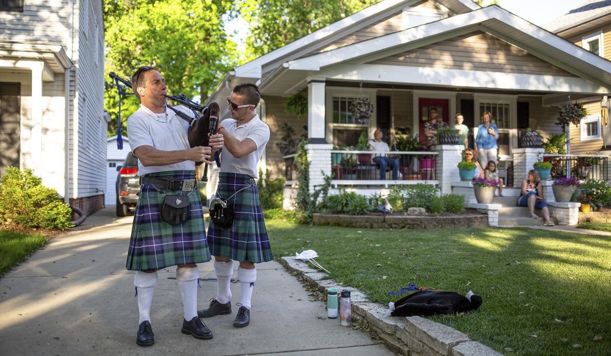 Father, son team up on bagpipes for COVID-19 relief 1