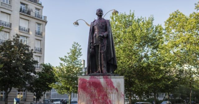 Protesters Deface French Colonial-Era Statues in Red
Paint 1