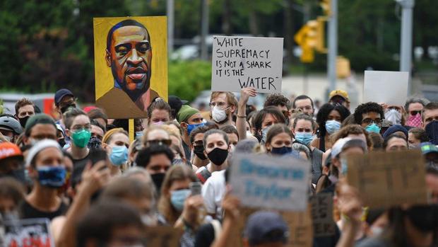 NYPD cop who shoved Brooklyn protester charged with
assault 1