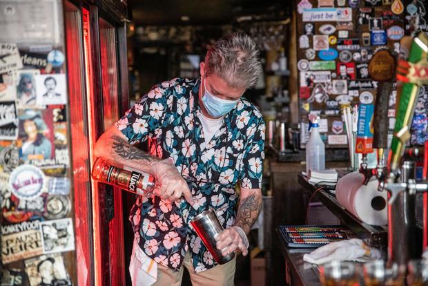 Amid coronavirus surge, Abbott expresses regret on reopening
bars 1