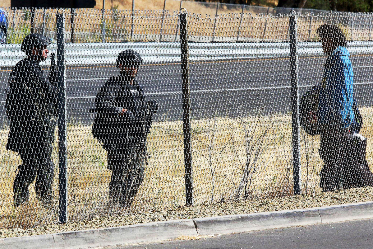 Shots fired in manhunt for California cop-shooter leads to
lockdown 1