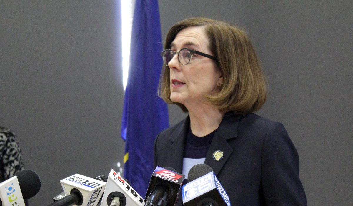 Kate Brown, Oregon gov., freezes reopening over surge in
coronavirus cases 1