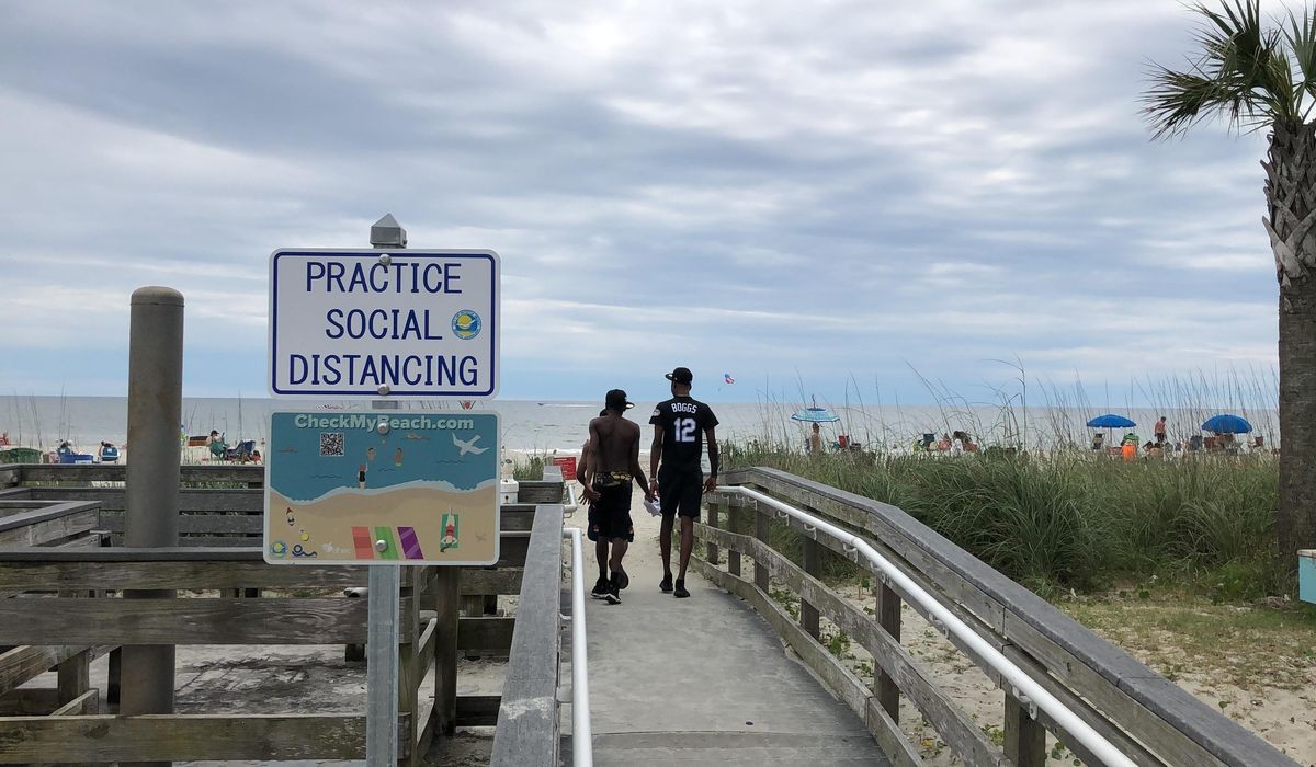 South Carolina beaches fill, but COVID-19 takes no
vacation 1