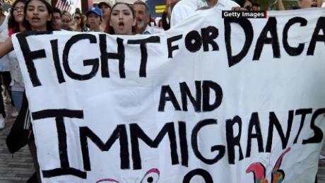 DACA recipient: My face shield, mask and hospital scrubs
cannot protect me 1