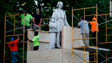 Baltimore protesters toppled a Christopher Columbus statue
and threw it in a harbor 1