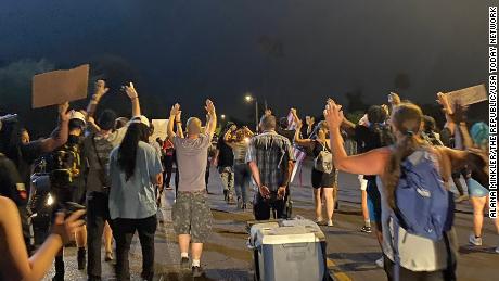 Phoenix police shot and killed a man in a parked car,
sparking renewed protests 1